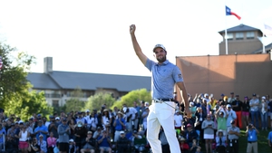 Corey Conners celebrates on the final green
