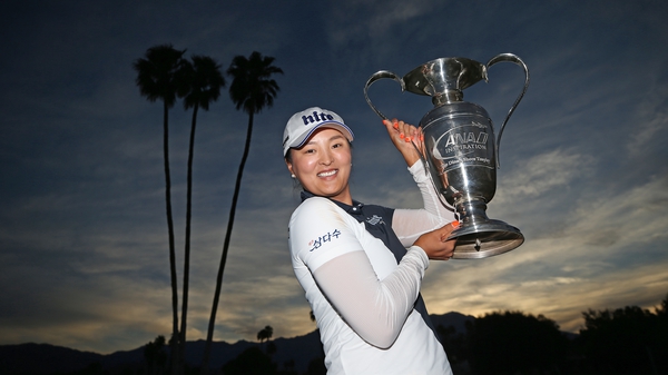 Jin Young Ko poses with the Dinah Shore Trophy