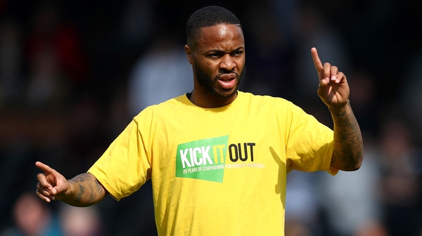 Manchester City's Raheem Sterling wears a Kick It Out anti-racism shirt