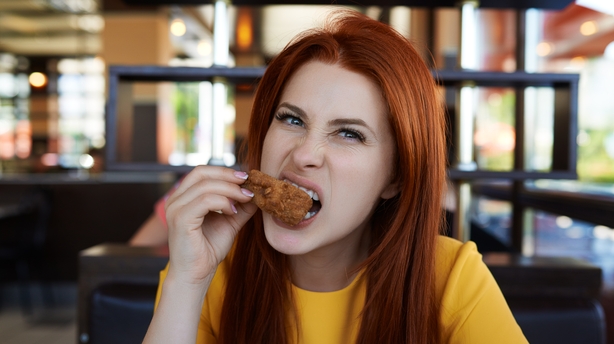 woman eating chicken wings