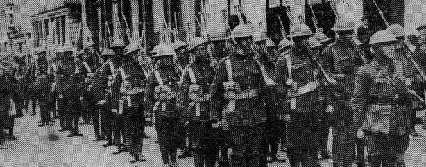 Military presence has increased around the country in recent weeks. In this photo the Royal Welsh Fusiliers line a side street in Limerick Photo: Sunday Pictorial, 13 April 1919 via Bureau of Military History