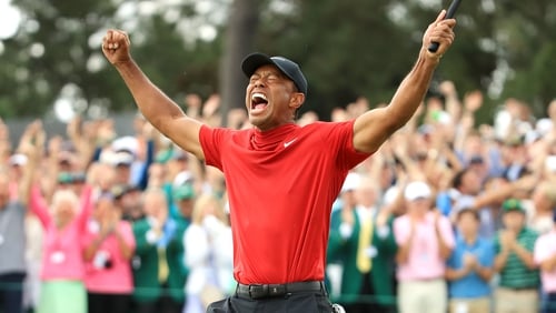 Tiger Woods held on to win the US Masters by one stroke, fourteen years after his last