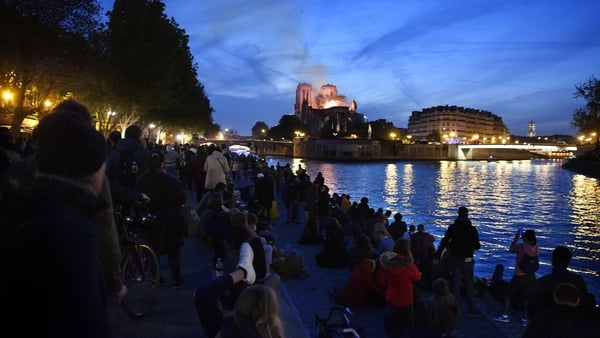Crowds gathered in disbelief on the banks of the Seine