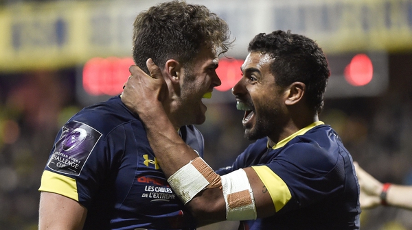 Clermont's centre Damian Penaud (L) celebrates with Wesley Fofana