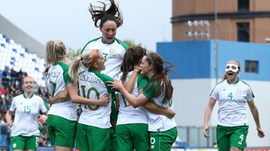 Ireland's Katie McCabe is mobbed after scoring against Italy