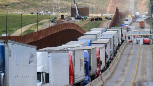Hundreds of trucks line up to cross into the US at the Otay Mesa checkpoint in Tijuana, Mexico