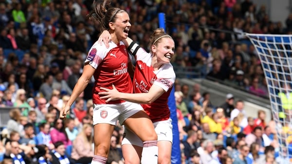 Katie McCabe celebrates scoring Arsenal's second goal with captain Kim Little