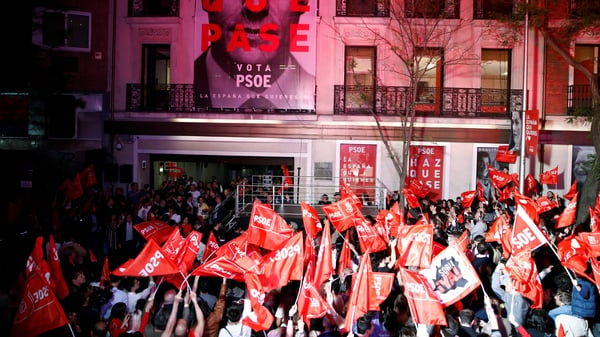 Supporters of the Socialist Workers' Party (PSOE) gather outside the party's headquarters in Madrid