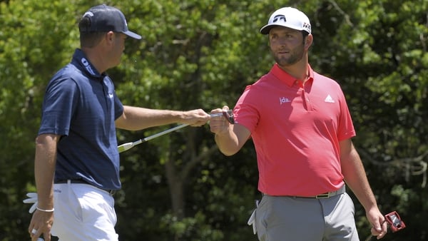 Ryan Palmer and Jon Rahm fist bump on the fourth hole on the final round in New Orleans