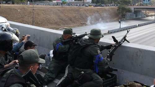 Soldiers loyal to Juan Guaido take position in front of La Carlota base in Caracas