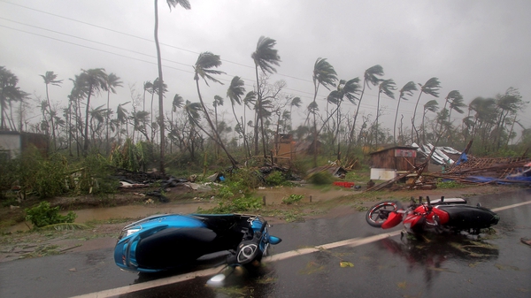 Damaged motorcycles lie on a road after Cyclone Fani made landfall in Odisha coast, India