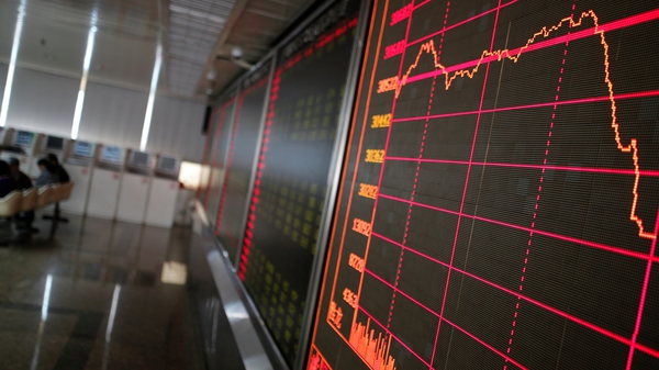 An electronic board displays the stock index at a securities brokerage house in Beijing