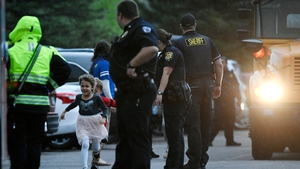 A young child runs to safety after the school was evacuated