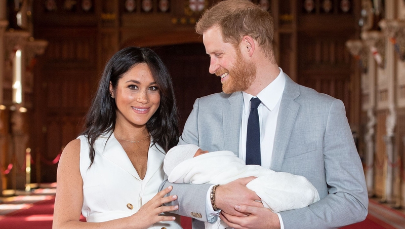 Meghan stuns in cream Givenchy dress in photos with new baby