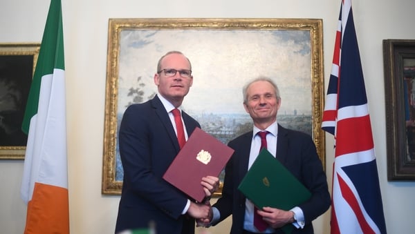 Then Tánaiste Simon Coveney (L) with former UK cabinet minister David Lidington signing a deal preserving the Common Travel Area in 2019