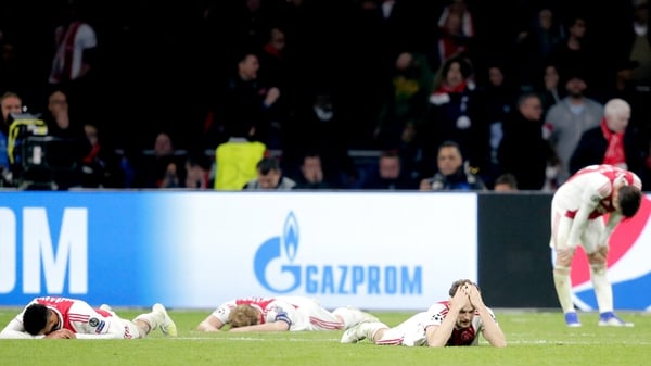 Noussair Mazraoui, Matthijs de Ligt and Daley Blind lie devastated on the turf