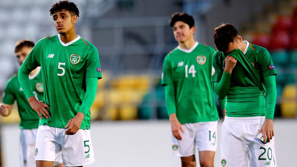 Ireland's Andrew Omobamidele (L) dejected after the game