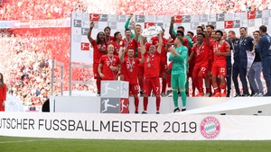 Franck Ribery of Bayern Munich lifts the trophy