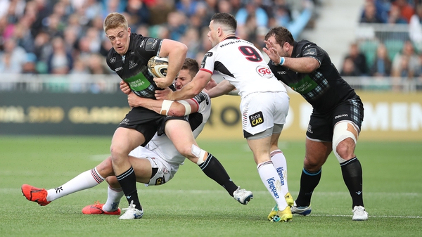 Kyle Steyn of Glasgow Warriors is tackled by Stuart McCloskey of Ulster