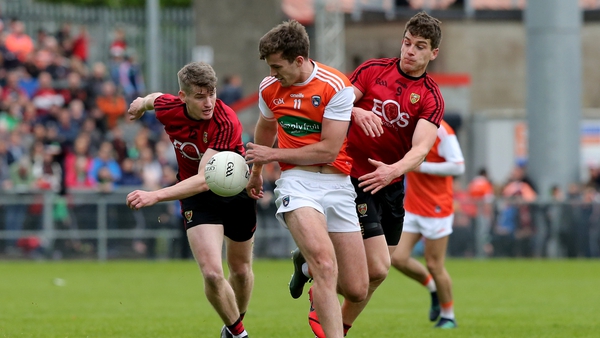 Down's Conor Maginn and Conor Poland with Ethan Rafferty of Armagh
