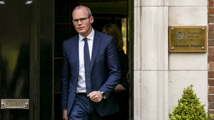 Simon Coveney also acknowledged that events at Westminster could prove a distraction for the Stormont process