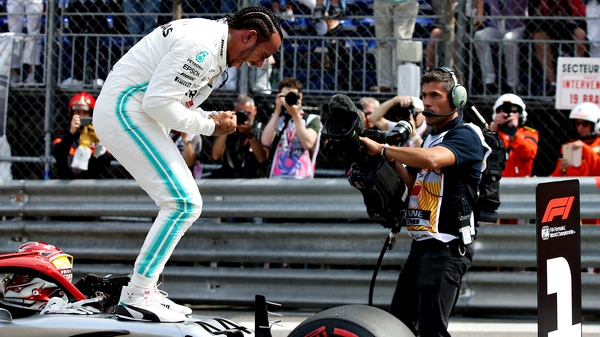 Lewis Hamilton celebrates after securing pole position ahead of the Monaco Grand Prix