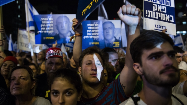 Opposition rallies against Benjamin Netanyahu who is seeking to form a coalition government
