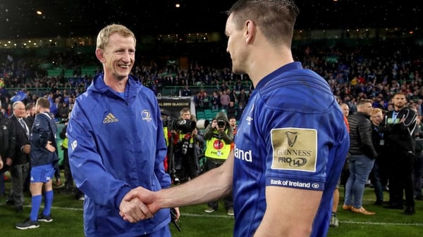 Leo Cullen congratulates captain Johnny Sexton following the victory at the home of Celtic FC