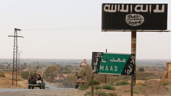 A billboard in Syria showing the Islamic State flag in 2017