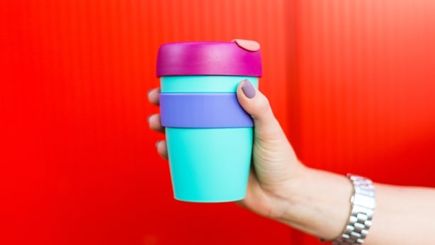 woman holding coffee cup