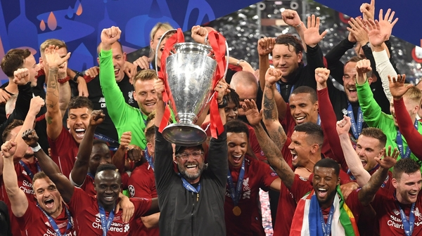 Liverpool manager Jurgen Klopp and his players celebrating with the Champions League trophy last June