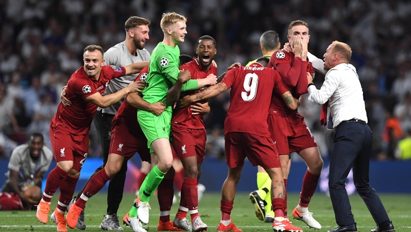 Liverpool goalkeeper Caoimhin Kelleher celebrates with his team-mates