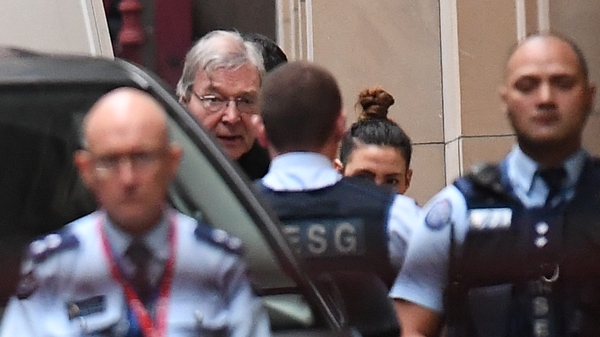 Pell arrived at court for his appeal wearing his clerical collar and a black coat