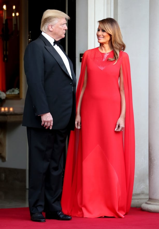 US President Donald Trump and his wife Melania wait to greet the Prince of Wales and the Duchess of Cornwall outside Winfield House, the residence of the Ambassador of the United States of America to the UK, in Regent's Park, London, for the Return Dinner as part of his state visit to the UK.