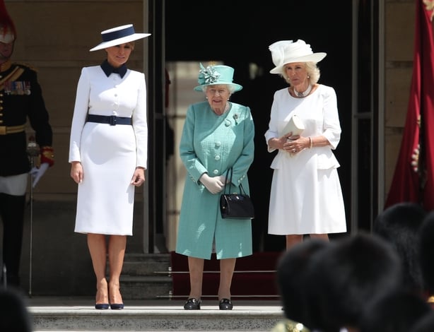 Melania Trump (left) and The Duchess of Cornwall (right) stand beside Queen Elizabeth II during the Ceremonial Welcome at Buckingham Palace, London, on day one of his three day state visit to the UK.