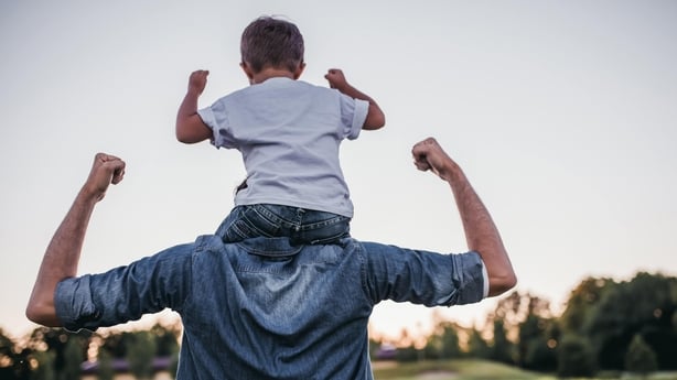 Dad and son having fun outdoors (iStock/PA)