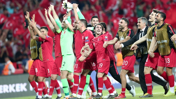 The Turkish players celebrate their win over world champions France