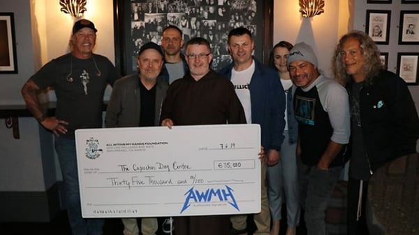 Metallica presenting the cheque to the Capuchin Day Centre
Photo: All Within My Hands/Metallica/Instagram