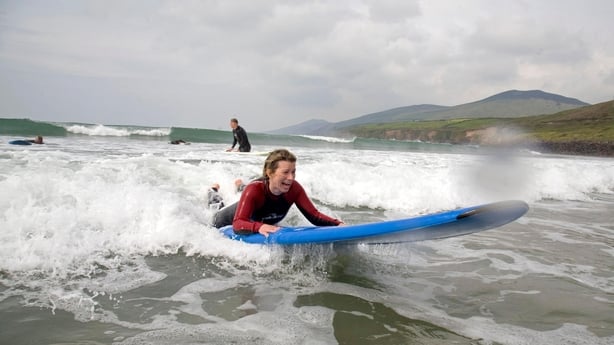 Abi Jackson surfing (sort of!) at Inch Beach (Tadhg Hayes/PA)