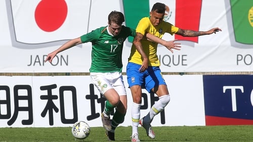 Ireland's Steven Mallon battles for possession with Iago of Brazil