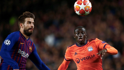 Ferland Mendy (R) in action against Barcelona for Lyon