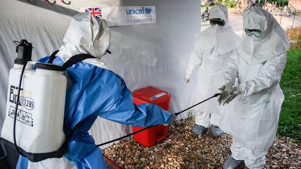 Medical staff of an Ebola Treatment Unit in western Uganda prepare for work