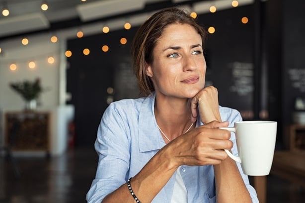 Mature woman drinking coffee
