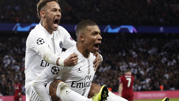 Neymar (L) and Kylian Mbappe after PSG scored agaisnt Liverpool in last season's Champions League