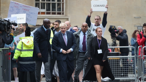 Conservative party leadership contender Boris Johnson (centre) arrives at BBC Broadcasting House in London