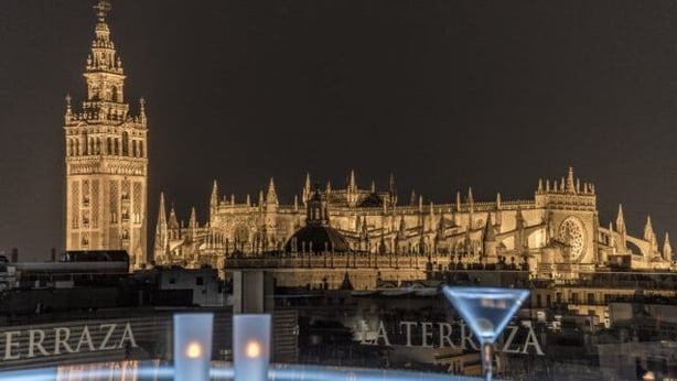 Seville Cathedral at night from the terrace of the Hotel Inglaterra (Turismo de Sevilla/PA)