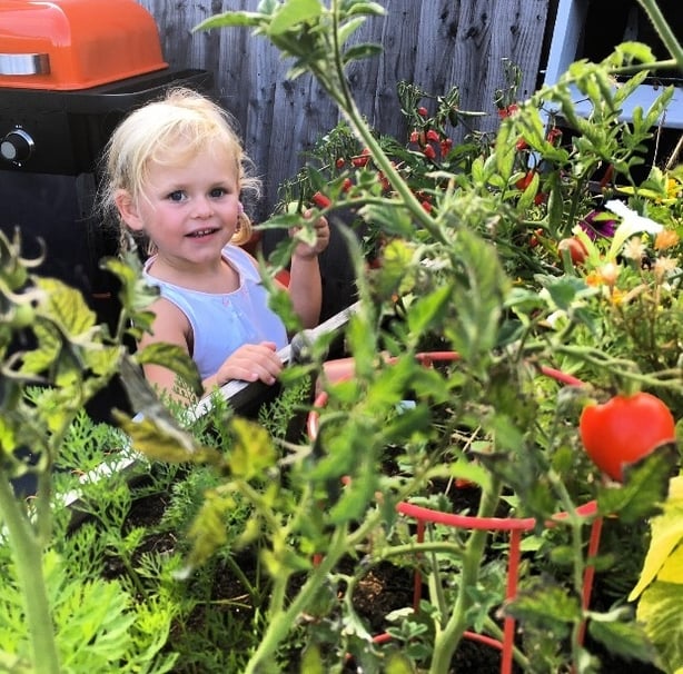 Lee encourages his daughter Olive to grow her own veg (Lee Connelly/PA)