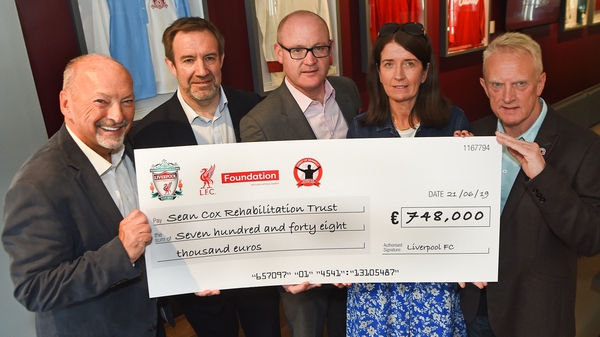 The cheque was presented to Sean Cox's wife Martina