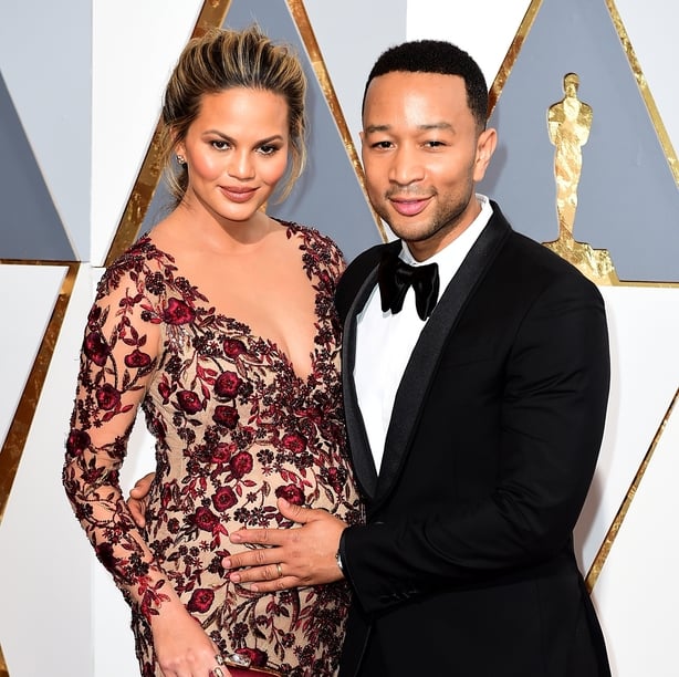 Chrissy Teigen and her husband John Legend when she was pregnant with her first child Luna (Ian West/PA)