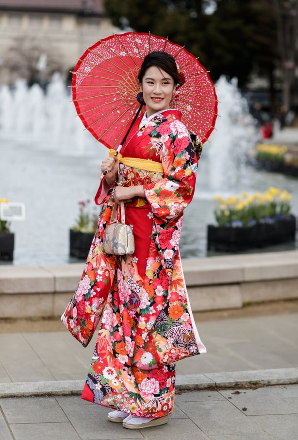 Traditional kimonos are still worn today – as seen on this woman in Tokyo (John WaltonPA)